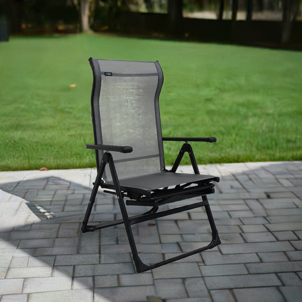 Caravan Sports Ergo Plus reclining folding chair on an outdoor patio